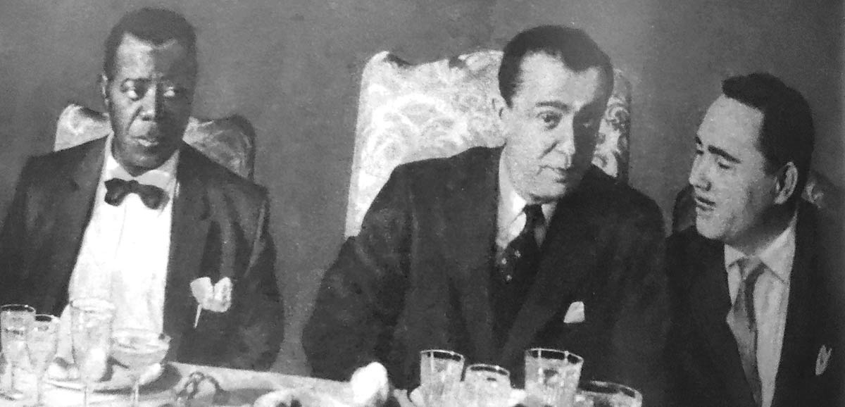 Da esq. para a dir.: Louis Armstrong, o Presidente Juscelino Kubitchek e Humberto Teixeira em banquete oferecido pelo governo brasileiro ao ilustra músico americano na década de 60